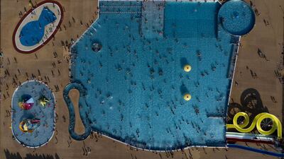 People swim in Warsaw as a heatwave hits Poland. Reuters