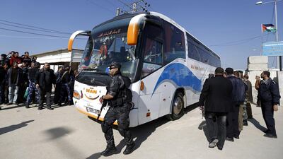 A bus carrying Palestinian ministers arrives in Beit Hanoun after entering the Gaza Strip through the Erez border crossing with Israel yesterday. Eight unity government ministers are in Gaza to talk about the reconstruction of the war-torn territory. Mohammed Abed / AFP