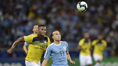 Diego Laxalt of Uruguay fights for the ball with Antonio Valencia of Ecuador during the Copa America Brazil 2019 group C match between Uruguay and Ecuador at Mineirao Stadium on June 16, 2019 in Belo Horizonte, Brazil. (Photo by Juliana Flister/Getty Images)