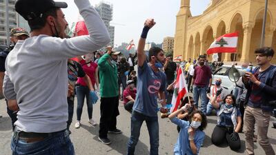 Anti-government demonstrators wearing face masks gesture as they protest during a countrywide lockdown to combat the spread of the coronavirus disease. Reuters