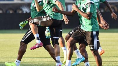Nigeria players shown warming up during their team training session on Monday in Chester, Pennsylvania, USA before their World Cup warmup friendly against Greece on Tuesday. Nicholas Kamm / AFP / June 2, 2014