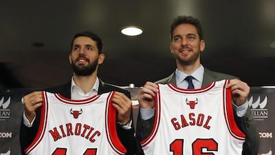 Nikola Mirotic, left, is presented by the Chicago Bulls alongside Pau Gasol in July 2014. Kamil Krzaczynski / EPA