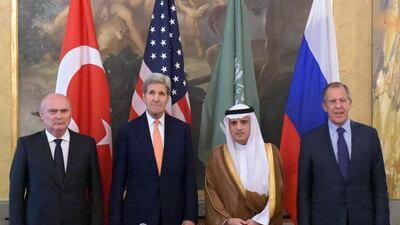 Turkish foreign minister Feridun Sinirloglu (L-R), US secretary of state John Kerry, Saudi foreign minister Adel Al Jubeir, and Russian foreign minister Sergei Lavrov pose for a photo during their meeting to discuss Syria at the Imperial Hotel in Vienna. Eduard Pesov/Handout/EPA