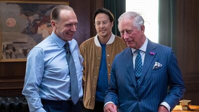 With actor Ralph Fiennes (left) and director Cary Joji Fukunaga (centre) on the set at Pinewood Studios in Iver Heath. Prince Charles is the patron of The British Film Institute and Royal Patron of the British Intelligence Services. Getty Images