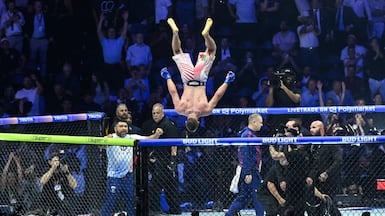 America's Justin Gaethje celebrates after defeating Georgia's Ilia Topuria during the UFC Freedom 250 mixed-martial arts event, in Washington. AFP