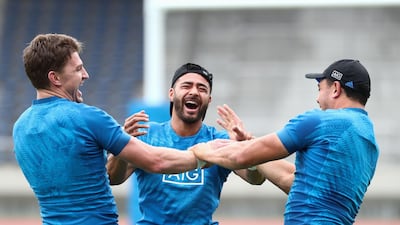From left to right: New Zealand's Beauden Barrett, Richi Mo’unga and Anton Lienert-Brown share a joke during training. AFP