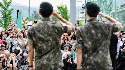 Fans gather to see members of K-pop boy band BTS in Chuncheon, after their release from 18 months of mandatory military service in South Korea. AFP