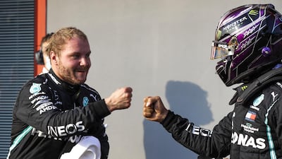 Valtteri Bottas of Mercedes with teammate Lewis Hamilton after taking the pole position at Imola. EPA