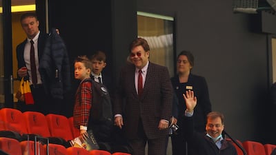 Elton John, in a checked shirt, watches a football match between Watford and Swansea City in Watford on May 8, 2021. Getty Images