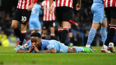 Manchester City's Raheem Sterling reacts after missing with a scissor kick attempt. AFP