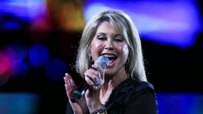 Olivia Newton-John was made a dame — the female equivalent of a knight — for her singing and acting and also for her charitable work supporting cancer research. AP