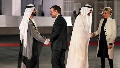 Sheikh Mohammed bin Rashid and Sheikh Mohamed bin Zayed greet Emmanuel Macron and First Lady Brigitte at the opening of Louvre Abu Dhabi. AFP