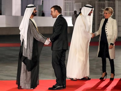 Sheikh Mohammed bin Rashid and Sheikh Mohamed bin Zayed greet Emmanuel Macron and First Lady Brigitte at hte opening of Louvre Abu Dhabi. AFP