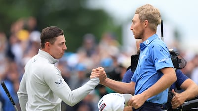 Matt Fitzpatrick and Will Zalatoris shake hands after completing the final round. Englishman Fitzpatrick carded a six-under 68 to win by a single shot. Reuters