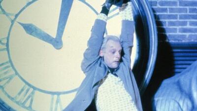 This photo released by Universal Pictures shows, Christopher Lloyd as Dr. Emmett Brown, in a scene from the 1985 film, "Back to the Future." Co-stars Lea Thompson, Lloyd and others gather on Tuesday, June 30, 2015, for a special screening of the 1985 Michael J. Fox time-travel blockbuster, to be presented on the massive Hollywood Bowl screen with musical score performed live and orchestra conducted by the original composer, Alan Silvestri. (Universal Pictures via AP)