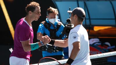 Rafael Nadal, left, is congratulated after defeating Marcos Giron. AP Photo /