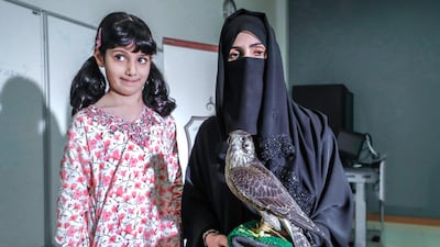 Ayesha Al Mansoori with her daughter and keen falconer, Osha Khaleefa Al Mansoori. Photo: Victor Besa for The National