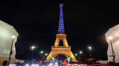 The Eiffel Tower is lit in the colours of Ukrainian flag in Paris. AFP