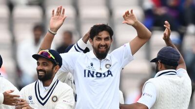India's Ishant Sharma celebrates taking the wicket of Henry Nicholls. AFP