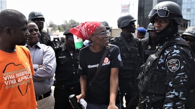 A protester confronts police. EPA