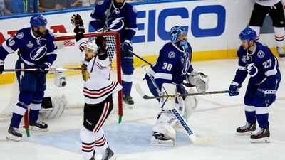 Antoine Vermette, centre, of the Chicago Blackhawks celebrates his third period goal against goaltender Ben Bishop of the Tampa Bay Lightning during Game 5 of the 2015 NHL Stanley Cup Final at Amalie Arena on June 13, 2015 in Tampa, Florida. Mike Carlson/Getty Images