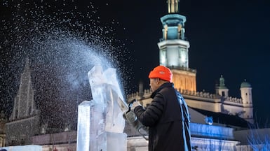 A contestant during a sculpture competition at the Poznan Ice Festival in Poznan, Poland. EPA
