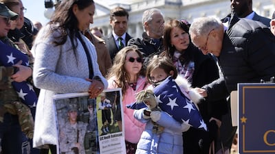 Mr Schumer greets Brielle Robinson. Getty Images / AFP