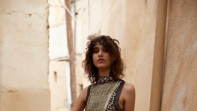 Grit and glamour: Dress, Dh32,600, Chloé. Boots, Dh2,405, Stuart Weitzman