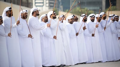 Traditional dancers perform during the group wedding at Qasr Al Hosn.