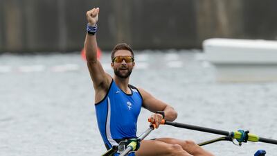Stefanos Ntouskos of Greece celebrates after winning the gold medal in the men's rowing single sculls final.