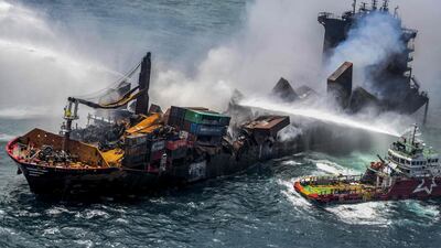 Smoke billows from the Singapore-registered container ship 'MV X-Press Pearl', which has been burning for the 11th consecutive day as efforts to put out the fire continue off Sri Lanka's Colombo Harbour. AFP
