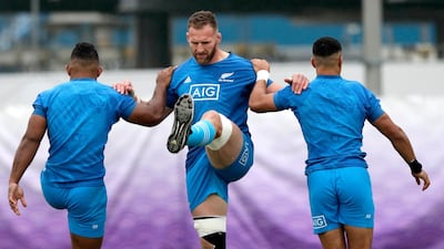 New Zealand's Kieran Read, centre, stretches during training. AP