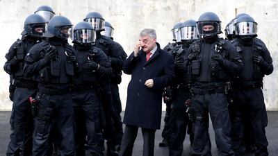 Herbert Reul, centre, Interior Minister of North Rhine-Westphalia, presents the German state’s unit responsible for arrests and securing evidence on February 4, 2019. EPA