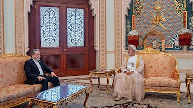 Iranian Foreign Minister Abbas Araghchi, left, meets the Sultan of Oman, Haitham, in Muscat. AFP