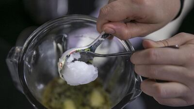 Step 7: Add as little as one and as many as two tablespoons of the organic, virgin coconut oil into the blender. Again, first-timers start out small – or nausea could ensue. Silvia Razgova / The National