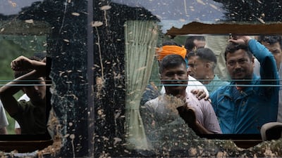 Grief at Jhyaple Khola in the Dhading District of Nepal as relatives and neighbours gather to identify the bodies of passengers after buses were buried in a landslide. EPA