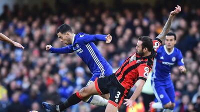 Chelsea forward Eden Hazard takes on Bournemouth defender Steve Cook. Glyn Kirk / AFP