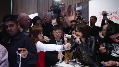 A staff demonstrates the new Huawei wearable watch at the Mobile World Congress in Barcelona. Simon Dawson / Bloomberg News