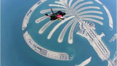 Harnessed to her skydive instructor, Ismat Abidi freefalls over the Palm in Dubai.