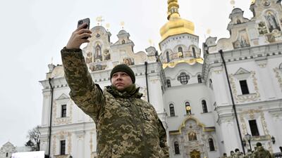 A Ukrainian serviceman takes a selfie in the grounds of Kyiv's Pechersk Lavra monastery. AFP