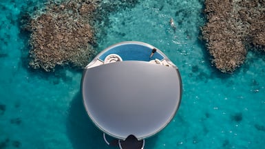 One of the stainless steel overwater villas. Photo: Shebara