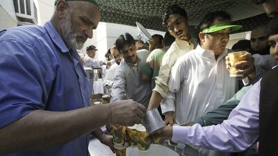 A man serves drinks.