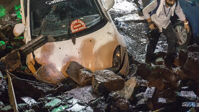A photographer surveys the remains of the bridge. EPA