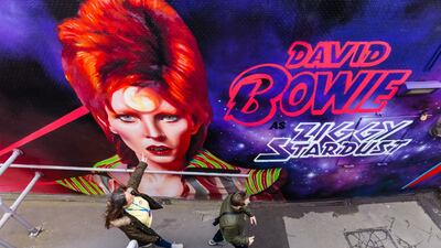 A mural depicting late British musician David Bowie, created by local artists We Are Sky High, was unveiled in Tolworth, Greater London, on Thursday. It celebrates the 50th anniversary of Bowie performing in the area. EPA