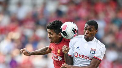 Roberto Firmino goes up for a header for Liverpool. AFP