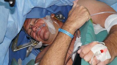 Neil Foster during surgery. Courtesy Neuro Spinal Hospital