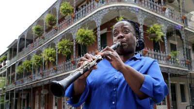 Musician Doreen Ketchens plays her clarinet at the corner of St. Peter and Royal streets in the French Quarter of New Orleans. AP Photo