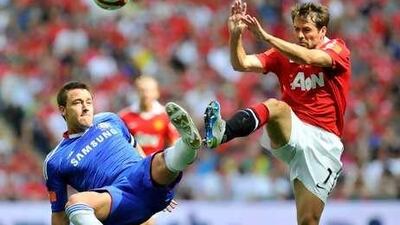 Chelsea's John Terry and Manchester United's Michael Owen challenge for the ball during their Community Shield match at Wembley Stadium.
