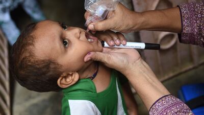 A health worker administers polio drops to a child during a vaccination campaign in Karachi on August 15. Pakistan and Afghanistan are the only countries where polio is endemic. AFP