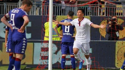 Cagliari's Han Kwang-song, right, celebrates after scoring a goal during the Italian Serie A match against Torino, at the Sant'Elia stadium in Cagliari, Italy, Sunday, April 9, 2017. Fabio Murru / AP Photo